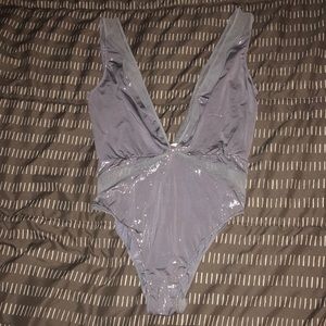 Low cut one piece never worn VS sparkly silver